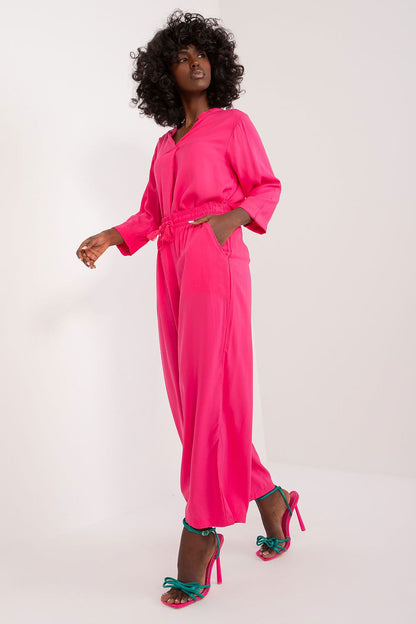 Model wearing Sublevel elegant women's palazzo pants, demonstrating a flattering high rise fit and chic casual style.