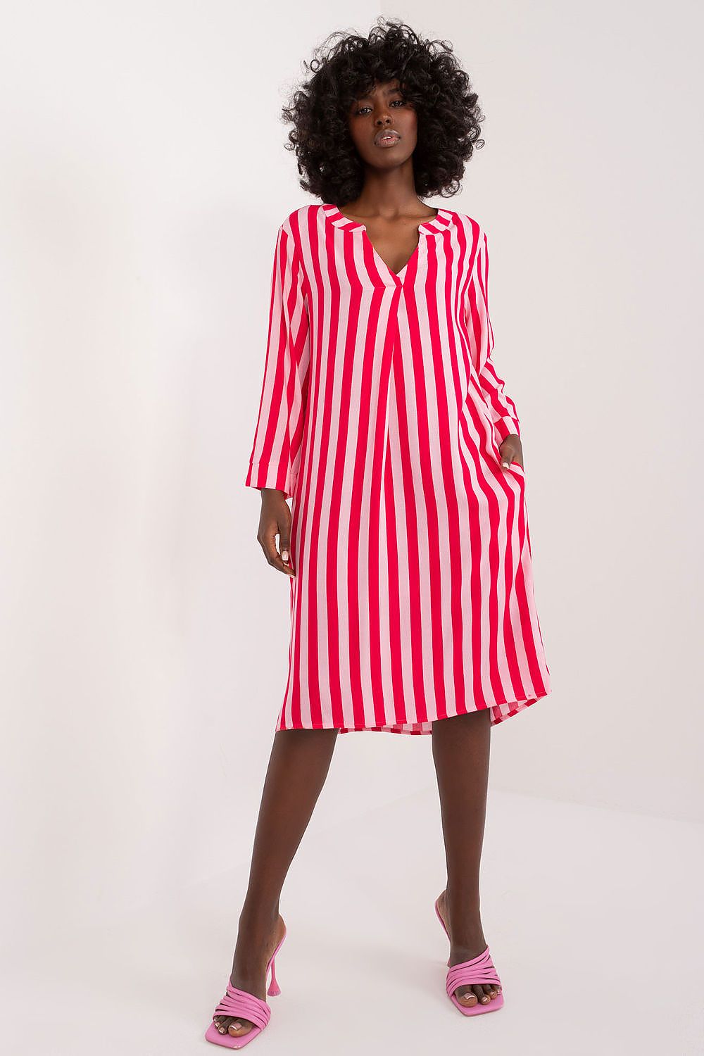Fashionable Sublevel oversized day dress with practical side pockets, highlighting its relaxed fit and vibrant print for a stylish everyday look.