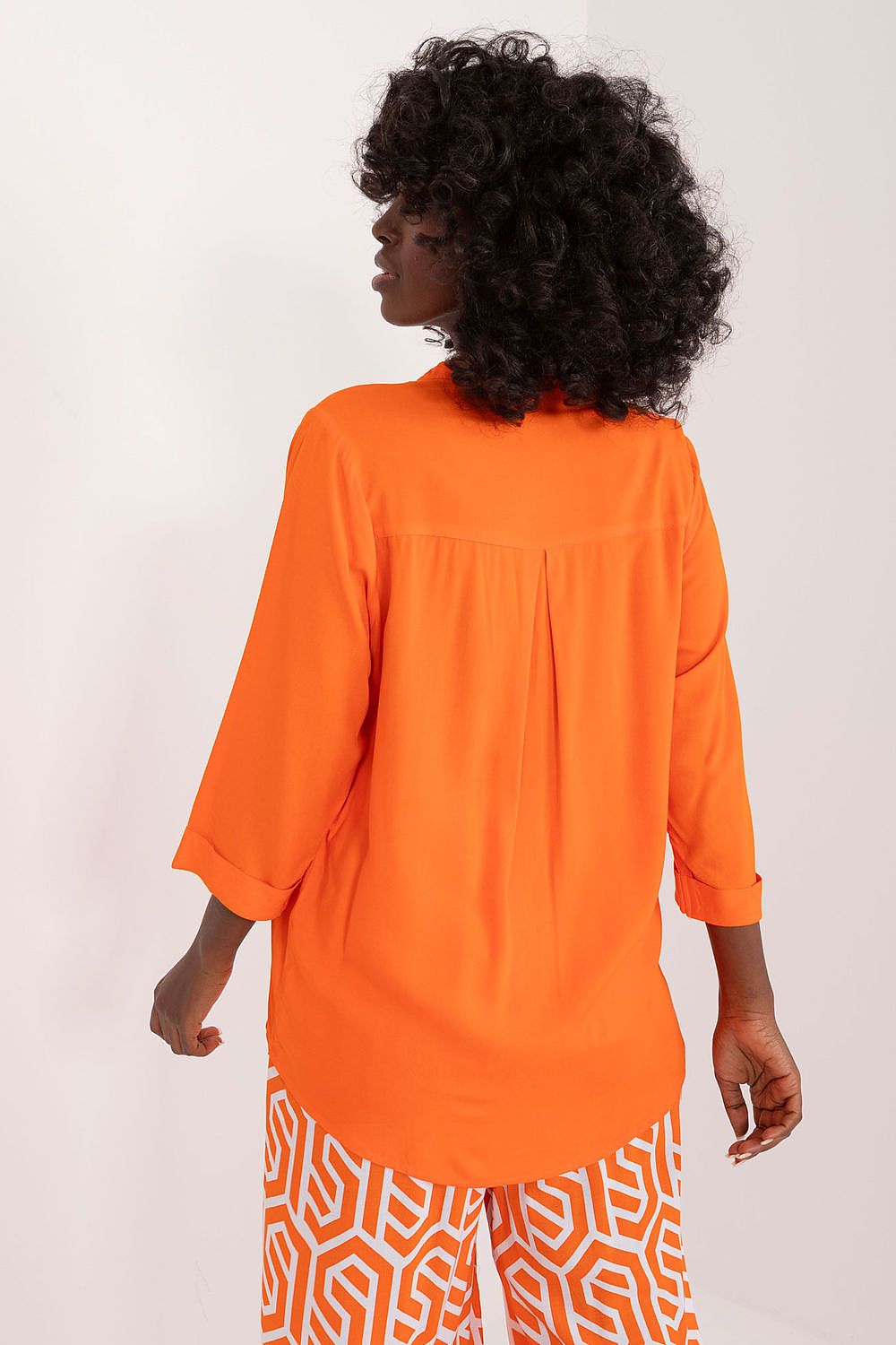 Close-up view of Sublevel's soft and breathable viscose fabric, showcasing the exquisite texture of the elegant blouse.