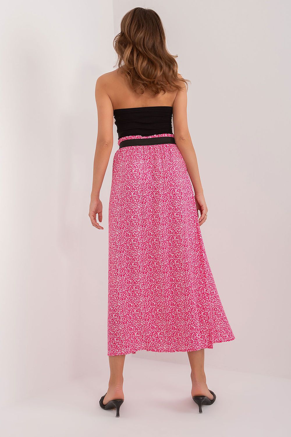 Model wearing the Sublevel elegant animal print maxi skirt, highlighting its flowing design and comfortable fit for sophisticated styling.