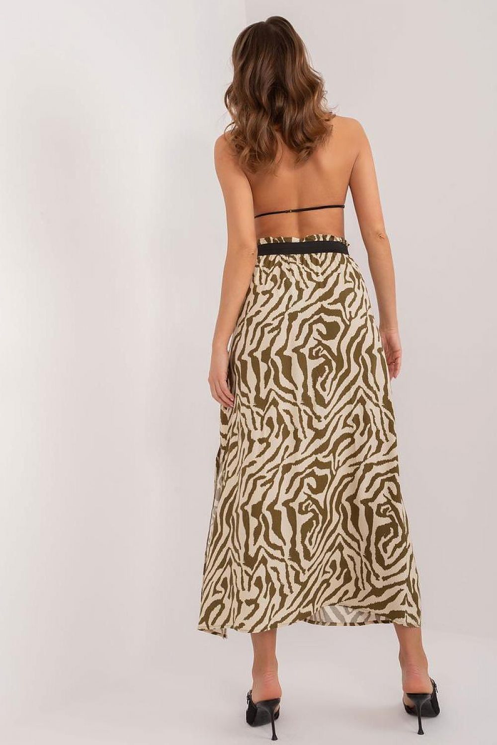 Sleek silhouette of the Sublevel Animal Print Maxi Skirt, featuring a graceful side slit and designed for fashionable everyday wear.