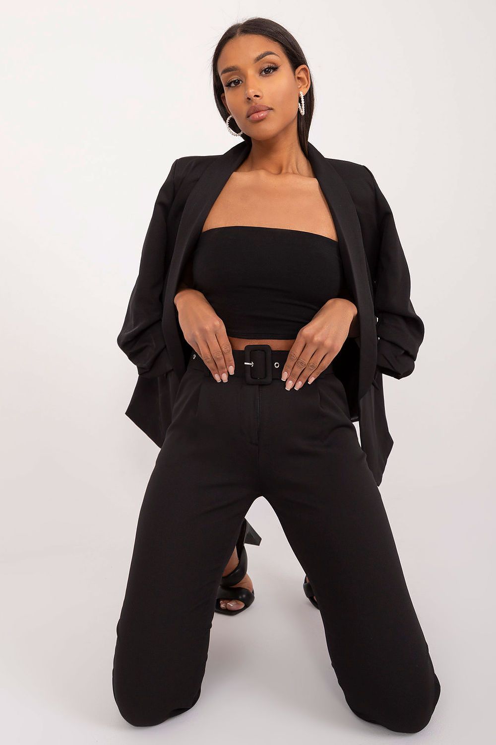 Detail of Och Bella Women’s Chino Trousers fabric, highlighting the fine polyester blend that ensures a chic finish and comfortable fit.
