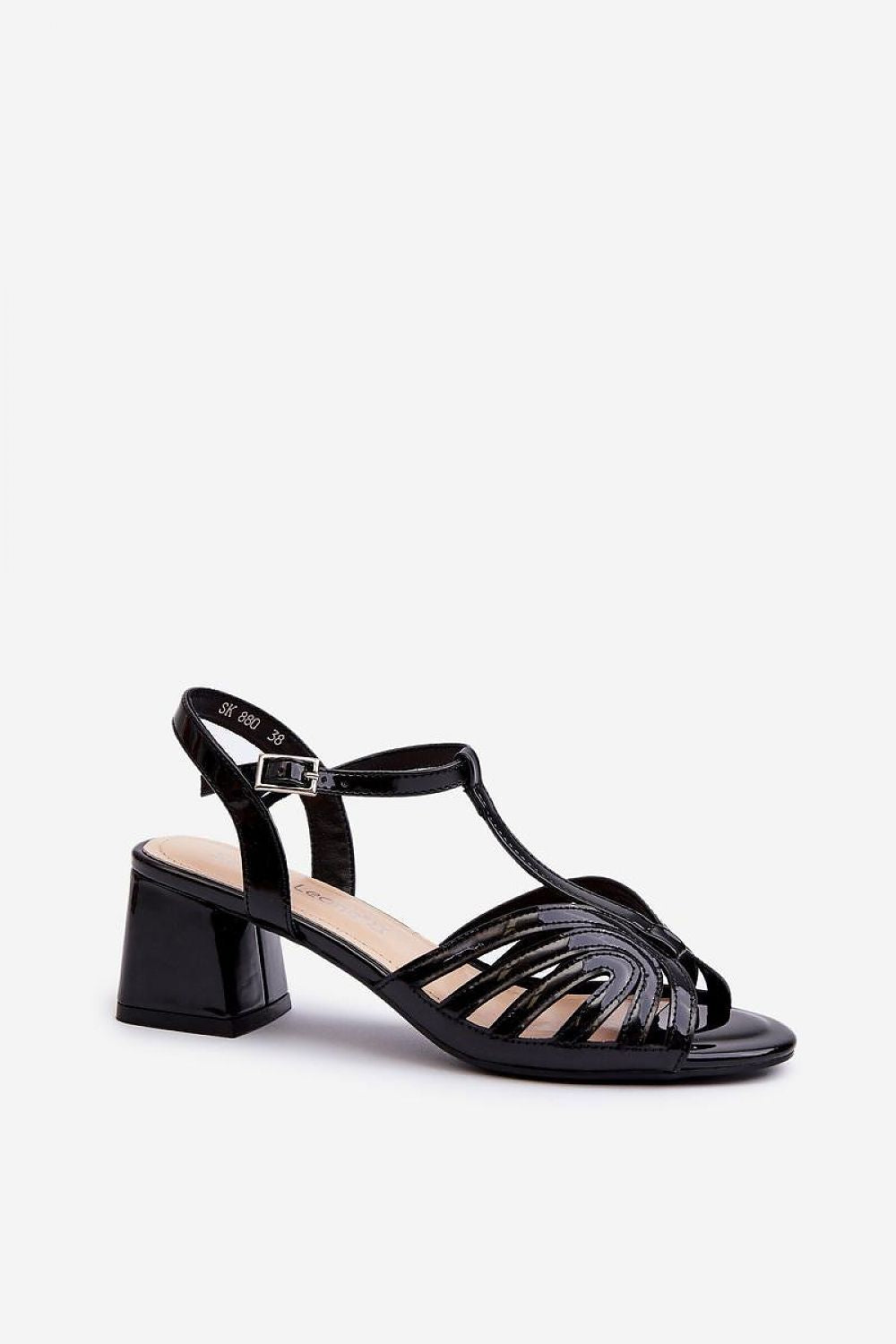 Step in Style elegant low block heel women's sandals featuring an adjustable buckle and comfortable leather footbed, perfect for classy outfits.
