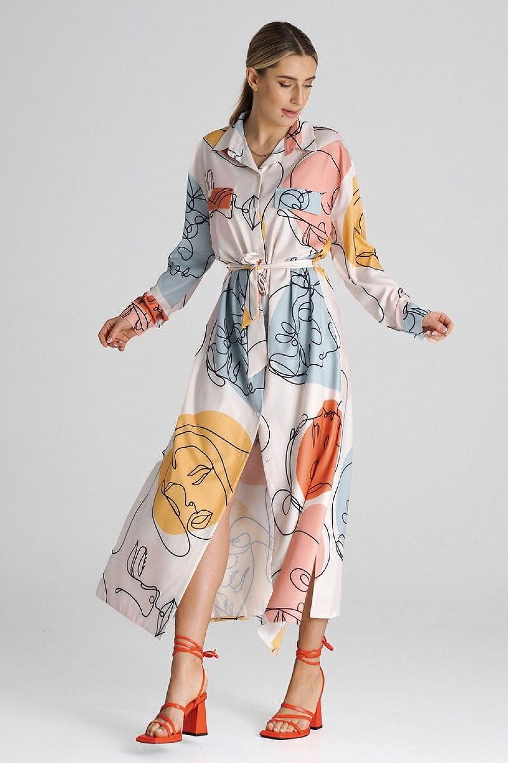 Close-up view of Figl maxi shirt dress collar and button detail showcasing luxury design elements and craftsmanship.