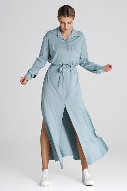 Close-up of the Figl maxi shirt dress showcasing the decorative flaps on the bust line and waist tie for a chic look.