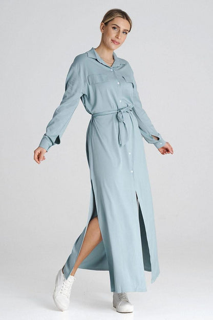 Side view of the Figl maxi shirt dress highlighting the long button-up style and elegant silhouette with side slits.