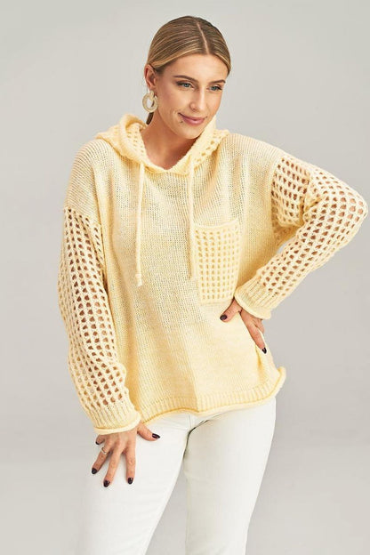 Figl's stylish long-sleeved jumper with a hood and decorative pocket, combining comfort with high-end fashion.