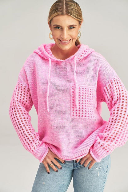 Stylish front view of Figl’s luxurious long-sleeved hooded jumper, featuring a fashionable decorative pocket detail.