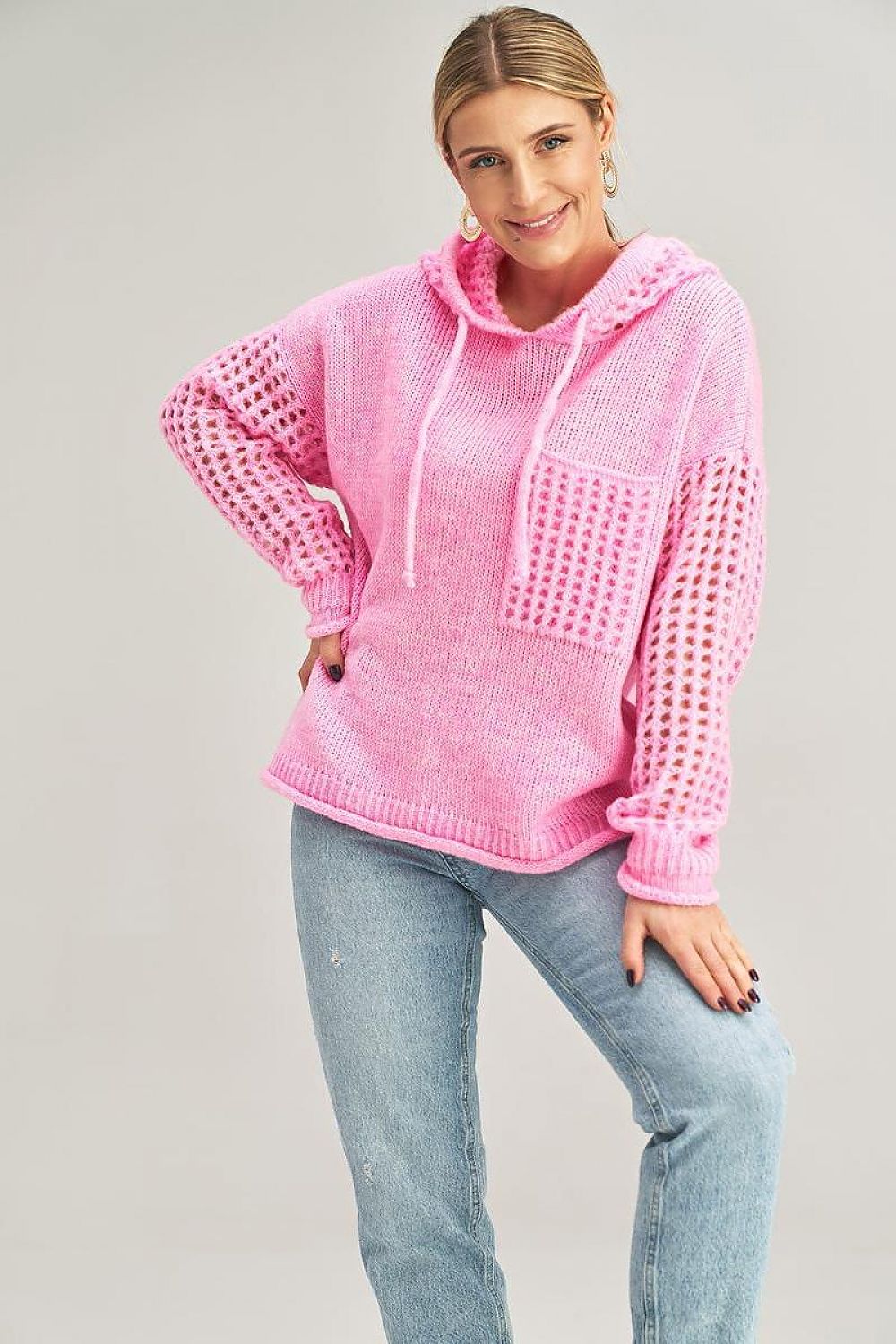 Close-up of Figl’s elegant hooded jumper showcasing its unique sleeve design and high-quality fabric blend.