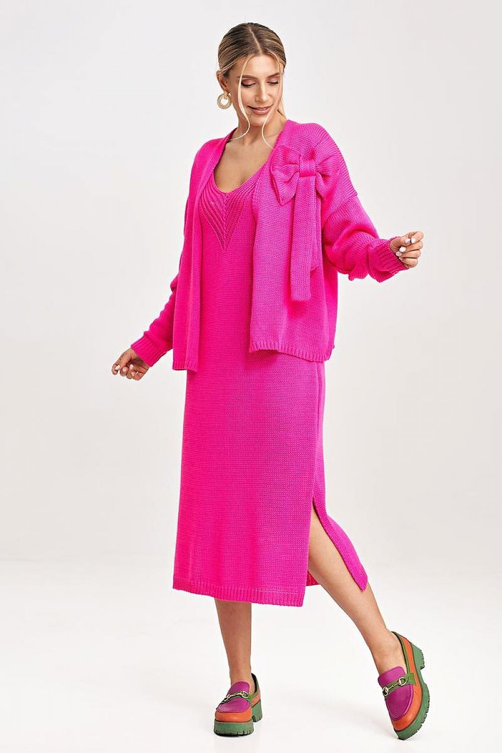 Fashion model wearing the Figl two-piece midi dress set, elegantly posed to demonstrate the versatility and charm of the bolero and midi dress design.