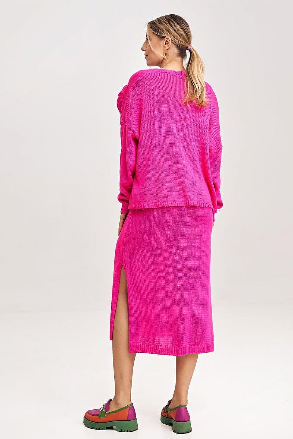 Luxury Figl two-piece midi dress set showcasing the elegant bolero with long sleeves and a decorative bow detail.