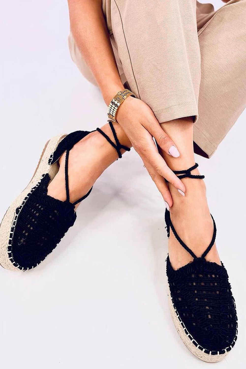 Stylish display of Inello's Women's espadrilles with ankle ties, exemplifying luxury with a unique woven pattern, perfect for sophisticated summer fashion.