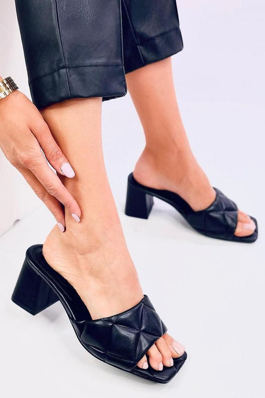 Elegant women's heeled mules by Inello featuring a 7.5 cm square heel and luxurious quilted eco leather design, perfect for special occasions.