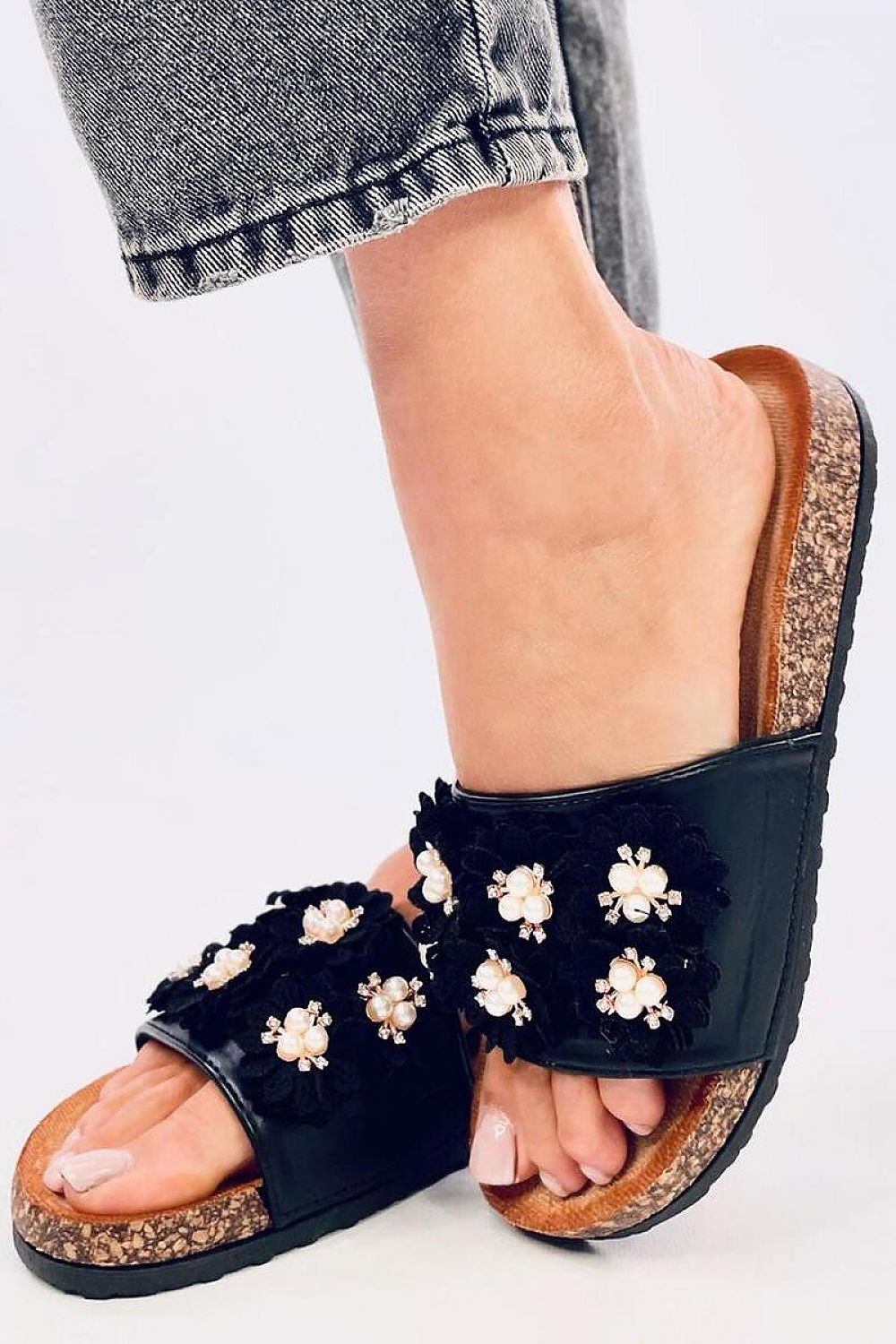 Elegant women's leather sandals by Inello featuring floral accents and sparkling rhinestones on a stylish cork sole, perfect for luxury summer outings.