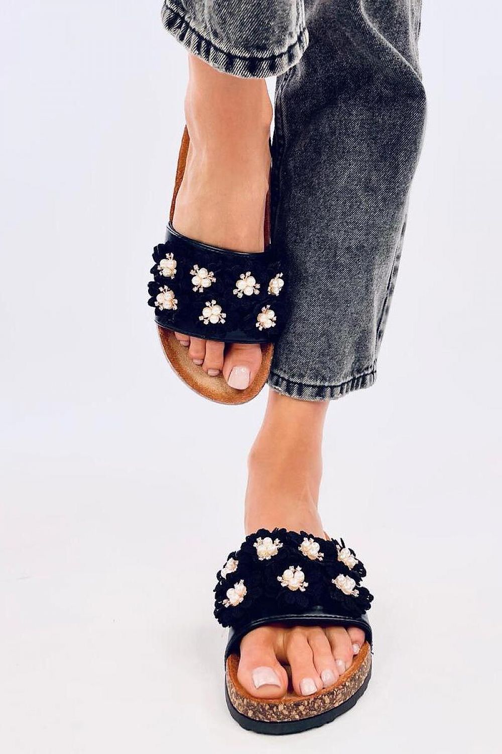 Close-up of Inello's exquisite women's sandals showcasing the luxurious eco-leather, floral embellishments, and shimmering rhinestones.