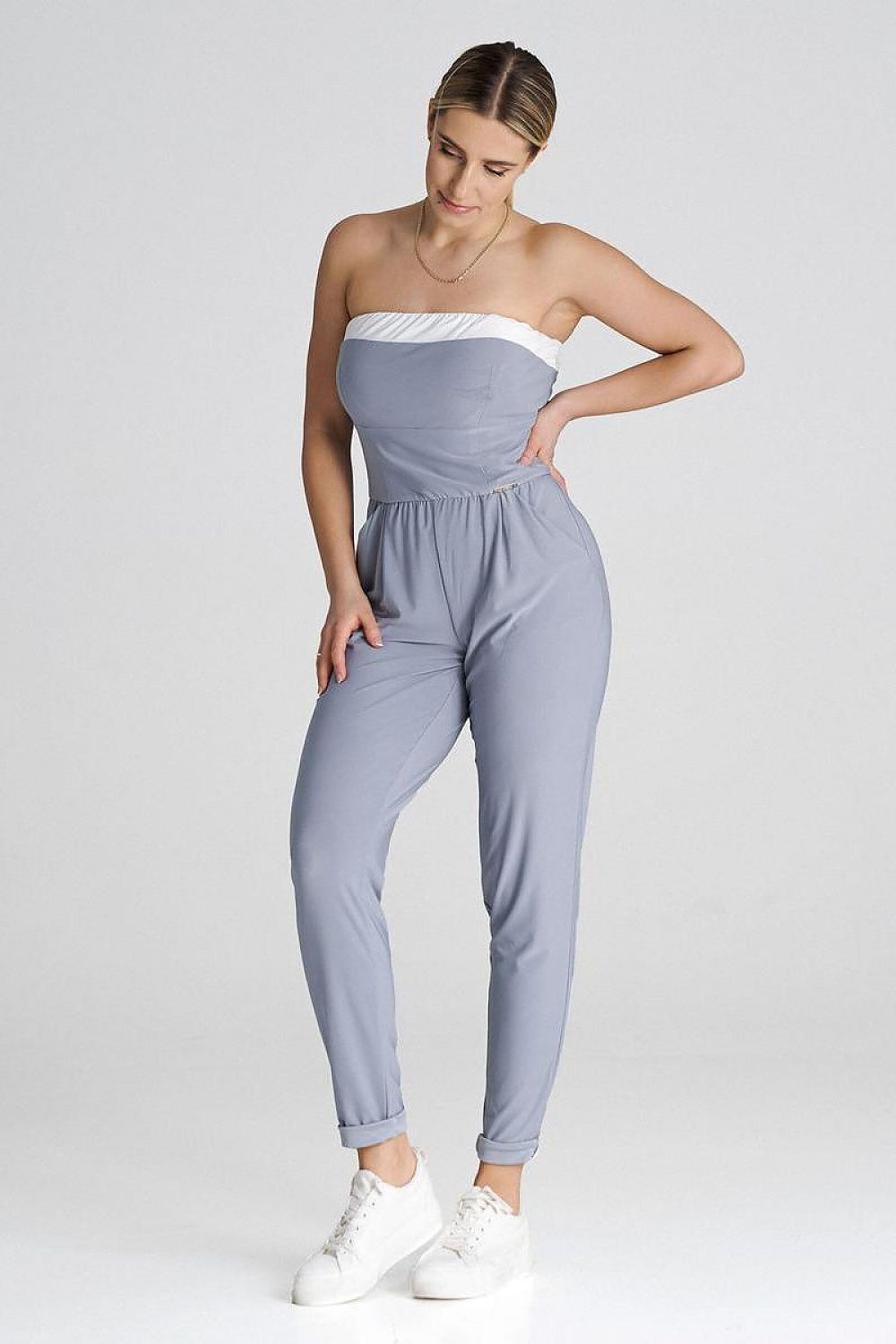 Stylish long leg pants of the Figl loose jumpsuit, highlighting a chic and fashionable silhouette perfect for elegant occasions.