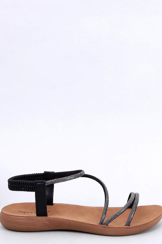 Elegant women's flat sandals crafted by Inello, featuring luxurious synthetic leather with dazzling cubic zirconia straps for a stylish and comfortable summer look.