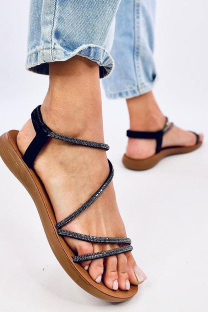 Chic and comfortable women's flat sandals from Inello, designed with exquisite cubic zirconia detailing on synthetic leather straps, perfect for elevating your summer outfits.