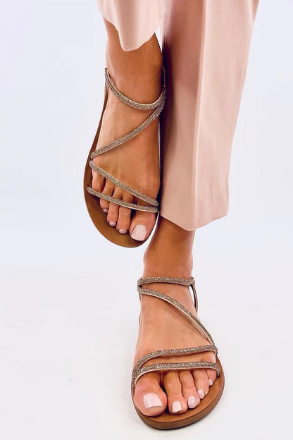 Elegant Inello Women's Sandals featuring exquisite zirconia stones on faux leather straps, designed for ultimate comfort with a lightweight flat sole, perfect for chic summer outfits.
