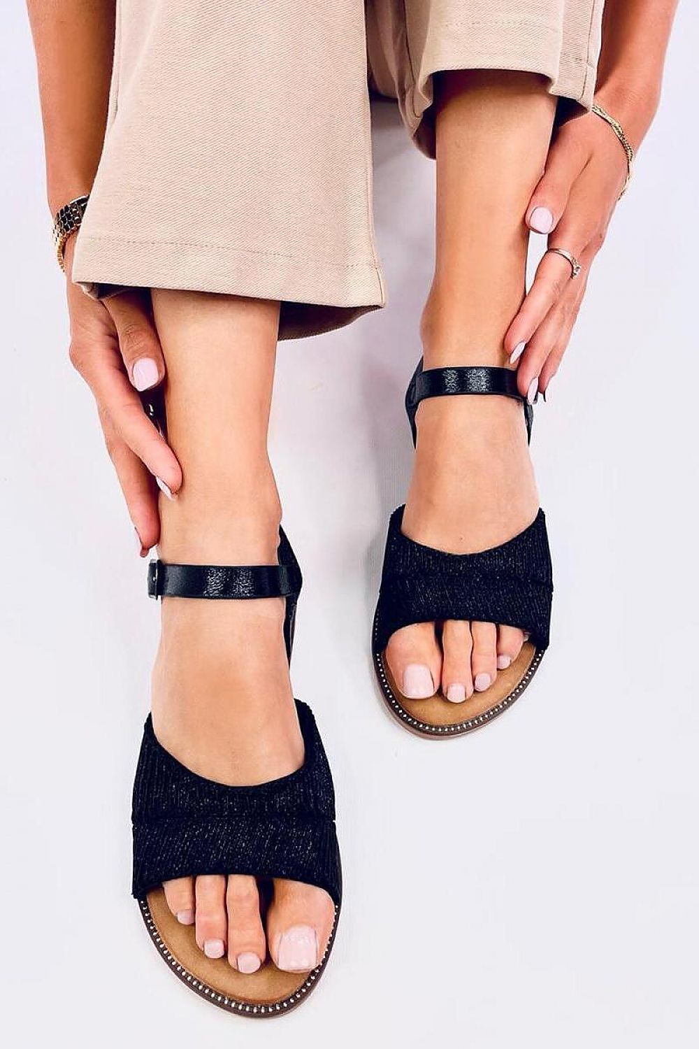 Elegant Inello Women's Flat Sandals with shiny metallic finish, offering stylish comfort for summertime outings.