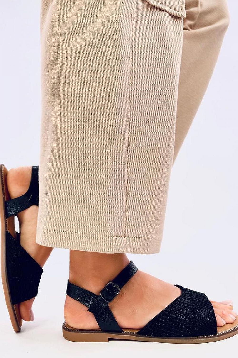 Close-up view of Inello Women's Metallic Flat Sandals, featuring exquisite craftsmanship and a chic design.