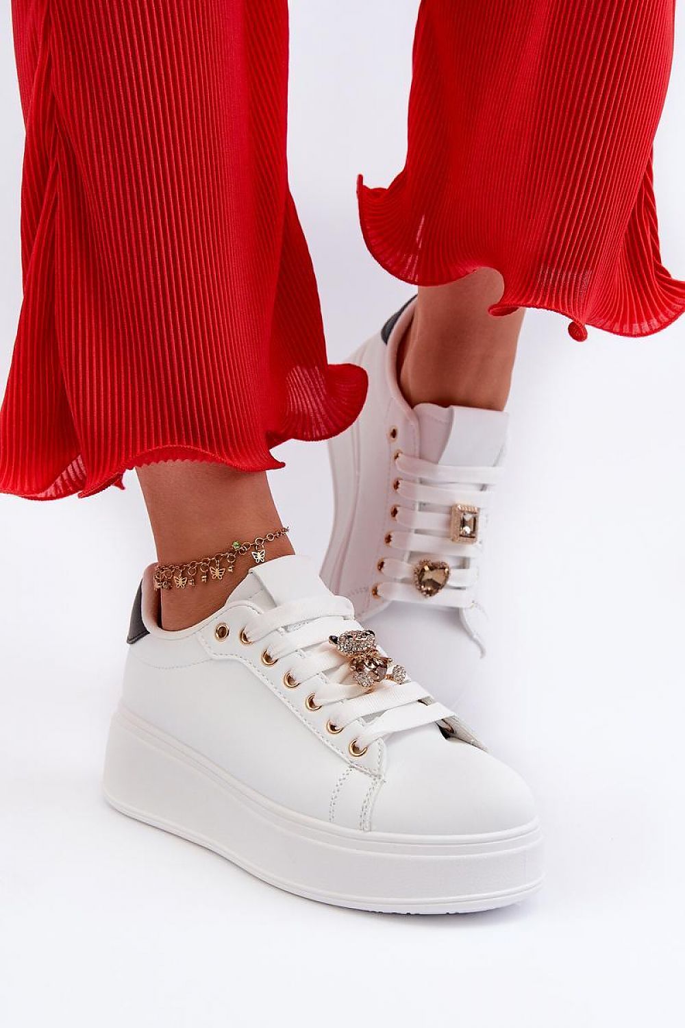 Elegant women's eco leather sneakers from Step in style, adorned with a teddy bear pin, ideal for both casual and dressy occasions.