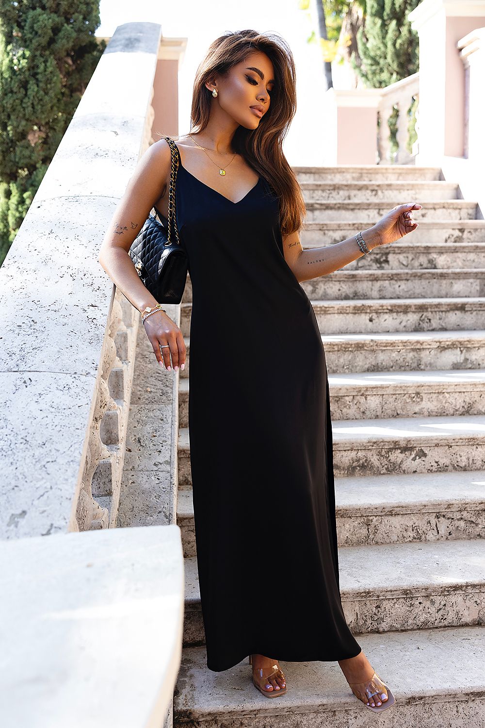 Luxury long satin lingerie-style dress with side slit and belt by IVON, perfect for elegant occasions with its flowing design and adjustable straps.