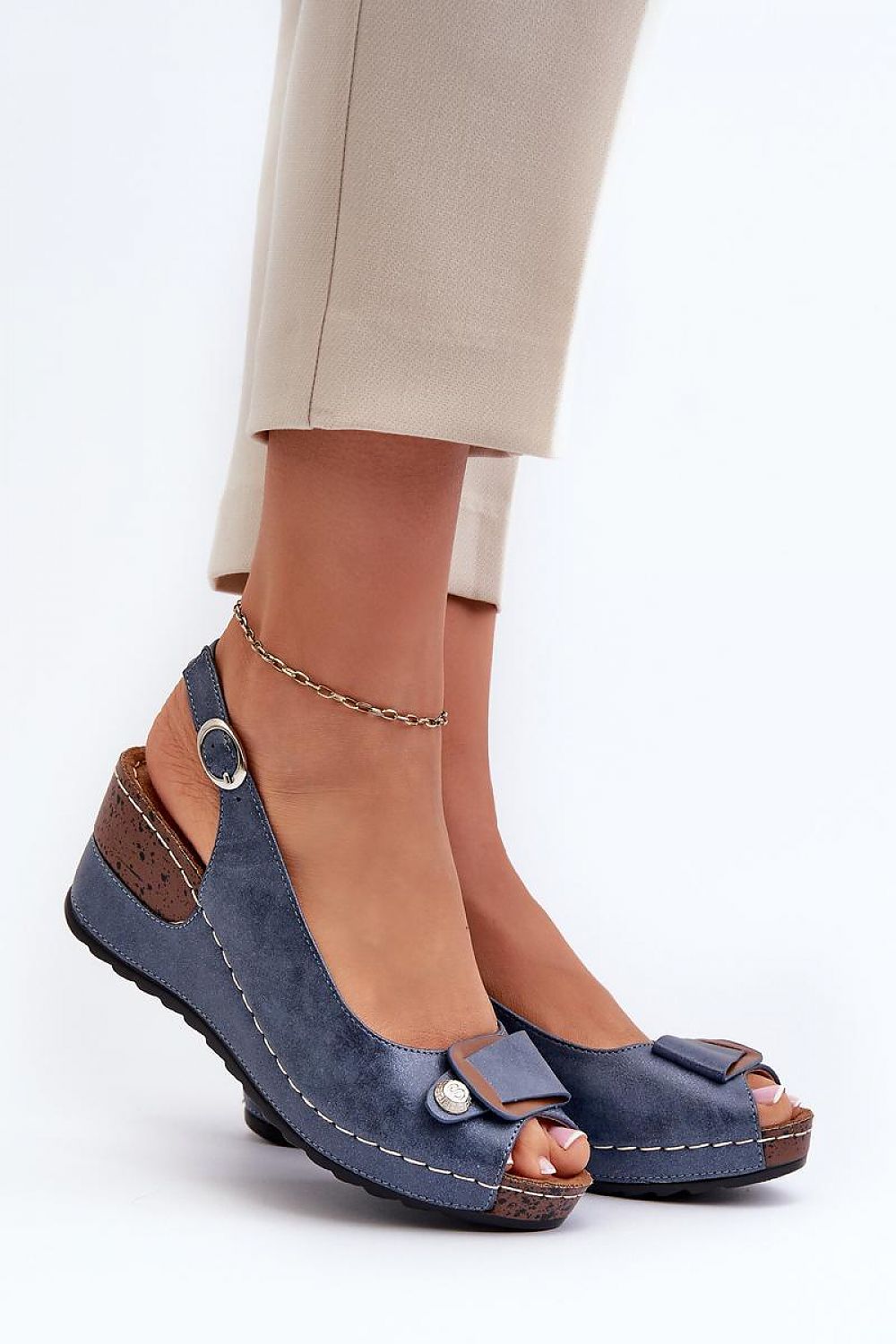 Elegant women's eco leather wedge sandals by Step in Style displayed on a neutral backdrop, showcasing their exquisite design and adjustable strap for a perfect fit.