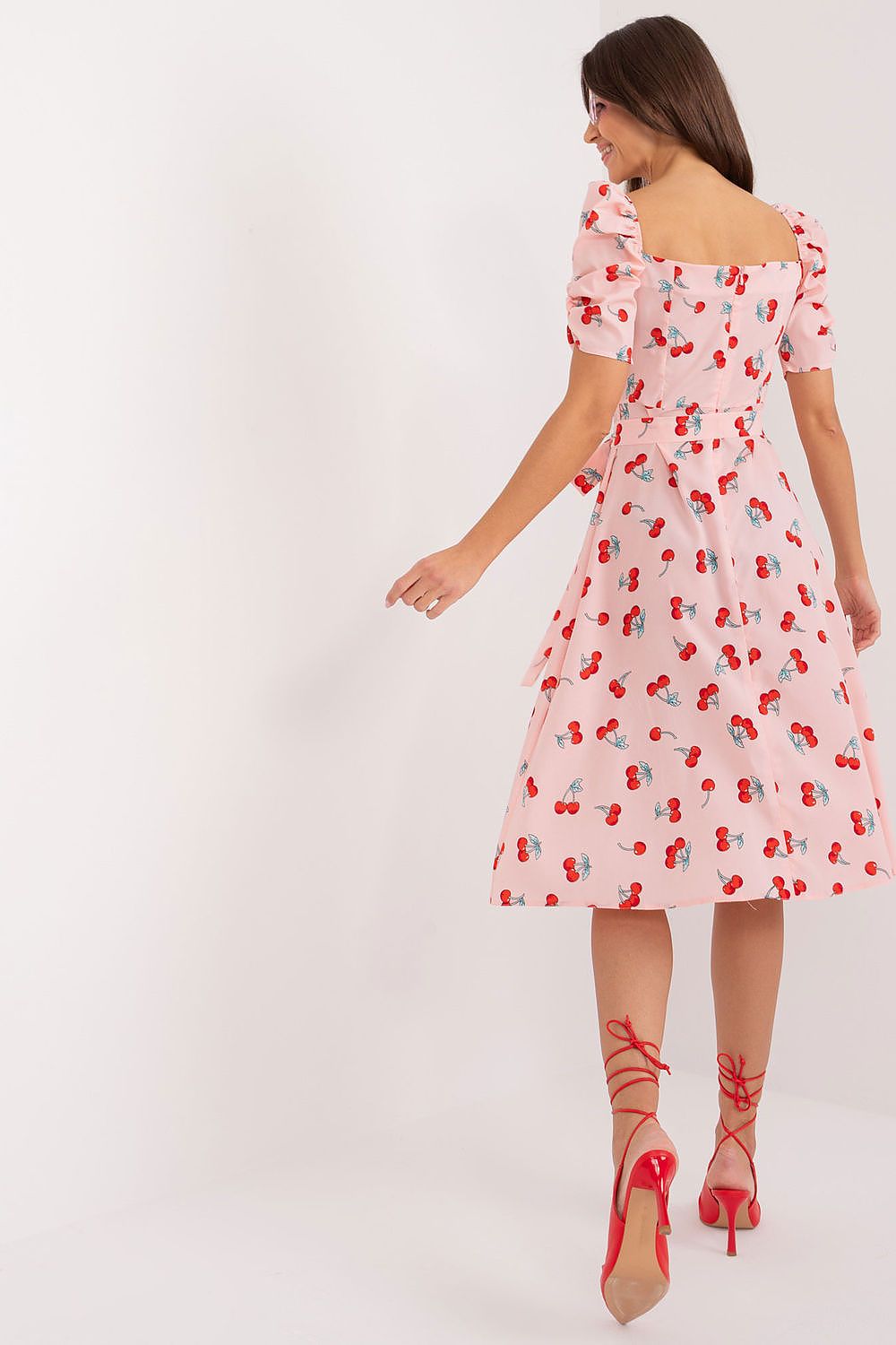 Elegant knee-length summer dress featuring a charming floral print and delicate puff sleeves, designed by Lakerta for a fashionable and fresh look.
