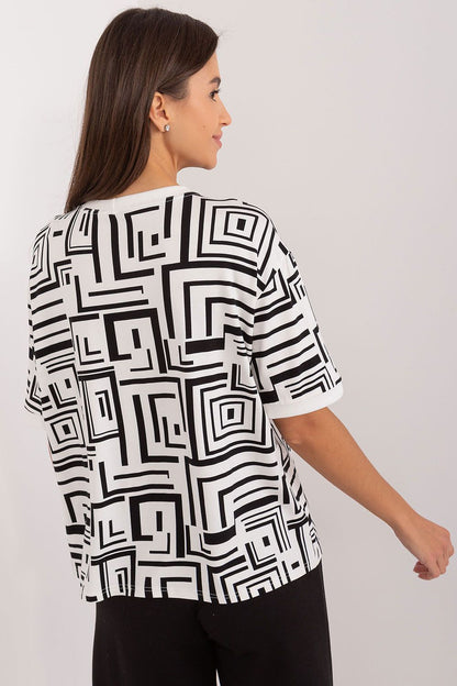 Elegant viscose blouse from Lakerta featuring a modern geometric pattern and a decorative fabric flower brooch, perfect for sophisticated women.