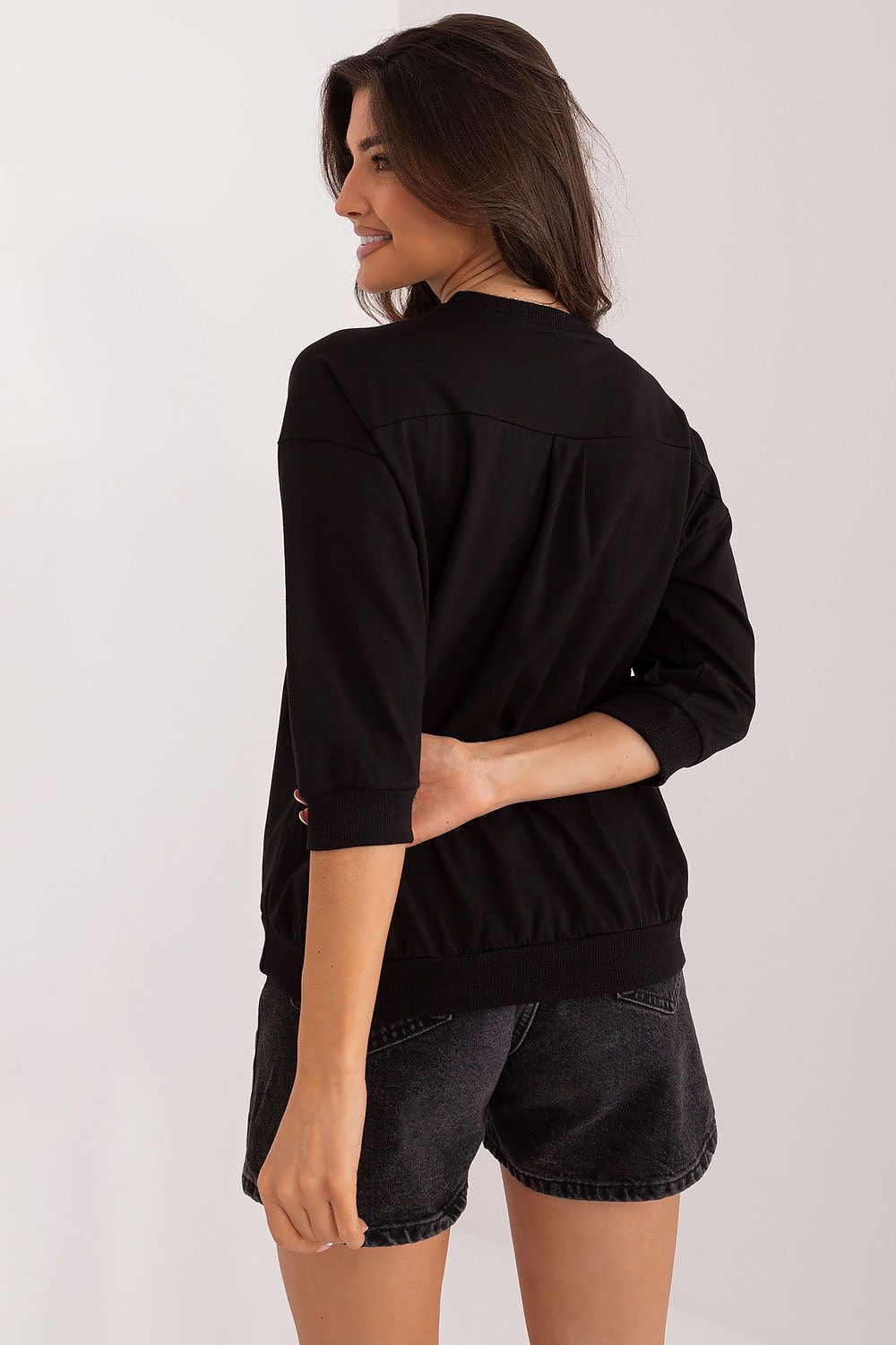 Lightly styled outfit with Relevance's elegant blouse, paired with tailored trousers, perfect for sophisticated office wear or casual outings.