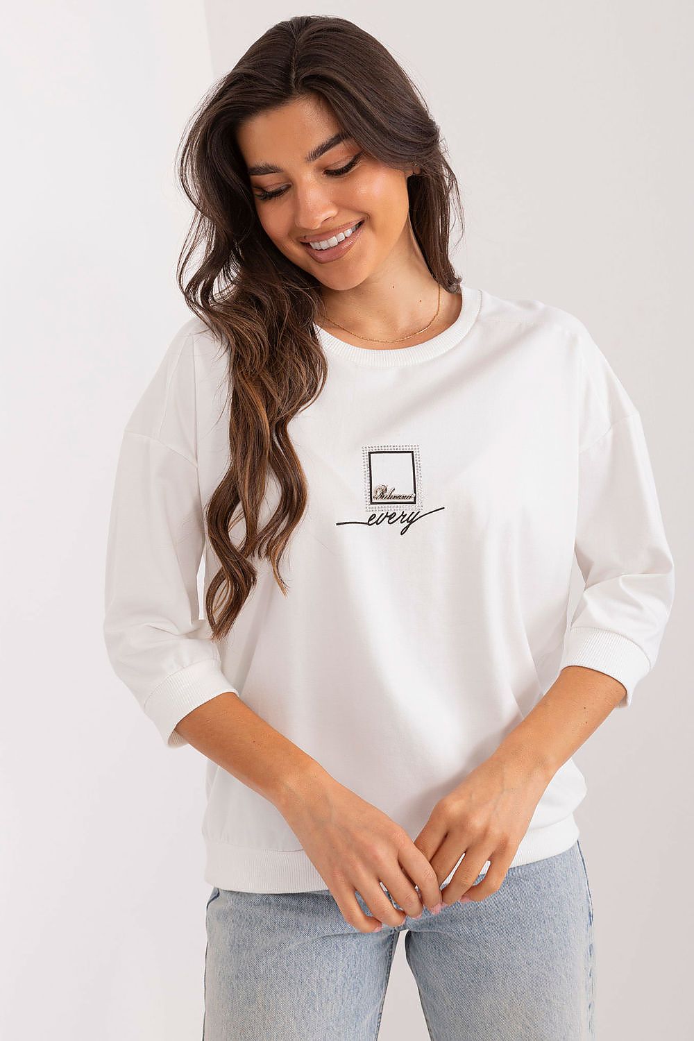 Profile view of the Relevance blouse highlighting the classic round neckline and 3/4 sleeves, designed for effortless style and elegance.