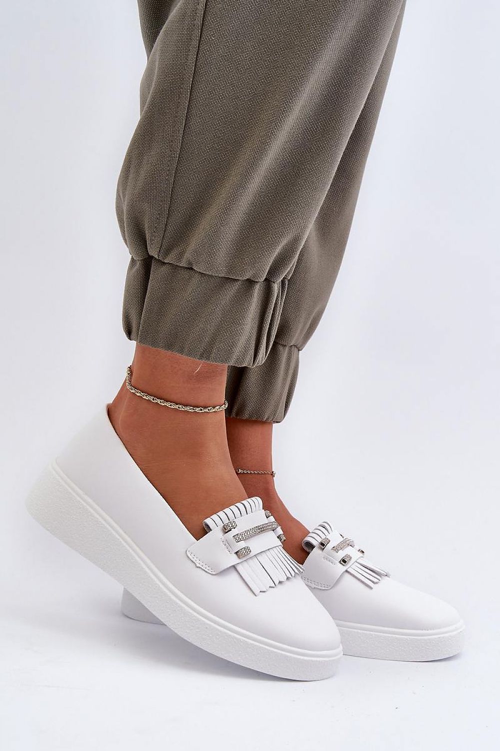 Elegant leather moccasins with tassels by Step in Style, featuring luxurious natural leather and cushioned footbed, perfect for a chic and comfortable look.