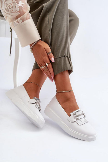 Exquisite leather moccasins from Step in Style featuring elegant tassels and plush cushioning, perfect for sophisticated casual wear.