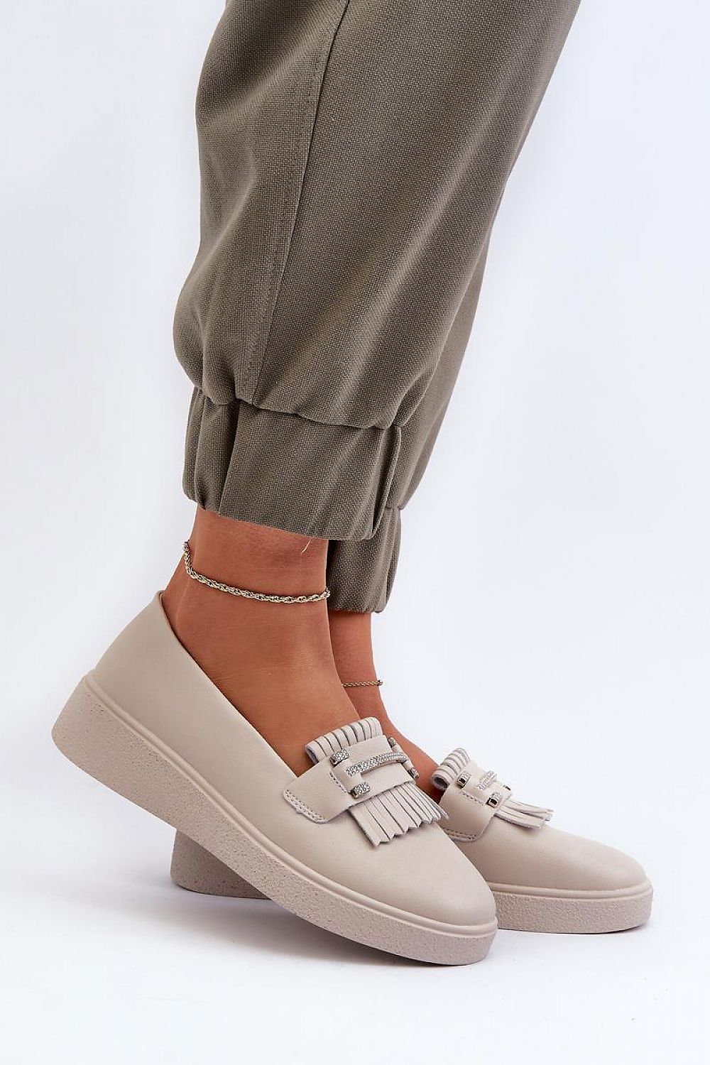 Luxurious black leather moccasins by Step in Style showcasing intricate tassel detailing, designed for comfort and style.