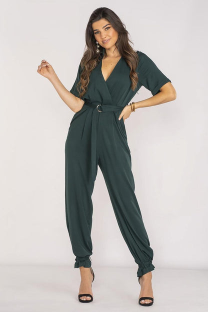 Elegant Awama jumpsuit featuring a classic collar and stylish envelope neckline, designed for summer outings with an elastic waistband and two side pockets, crafted in Poland.