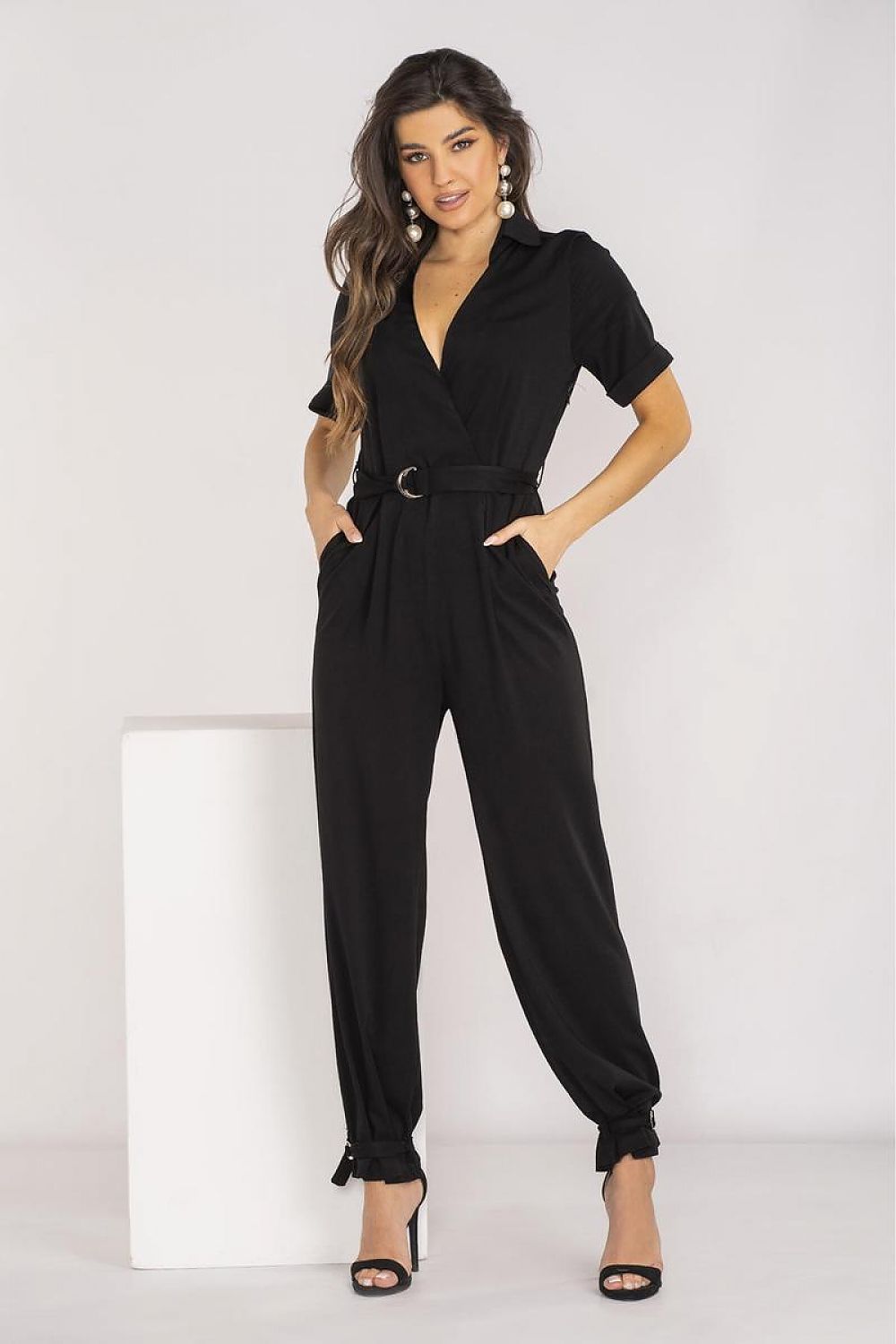 Stylish Awama jumpsuit showcasing short sleeves and side pockets, ideal for warm-weather fashion.