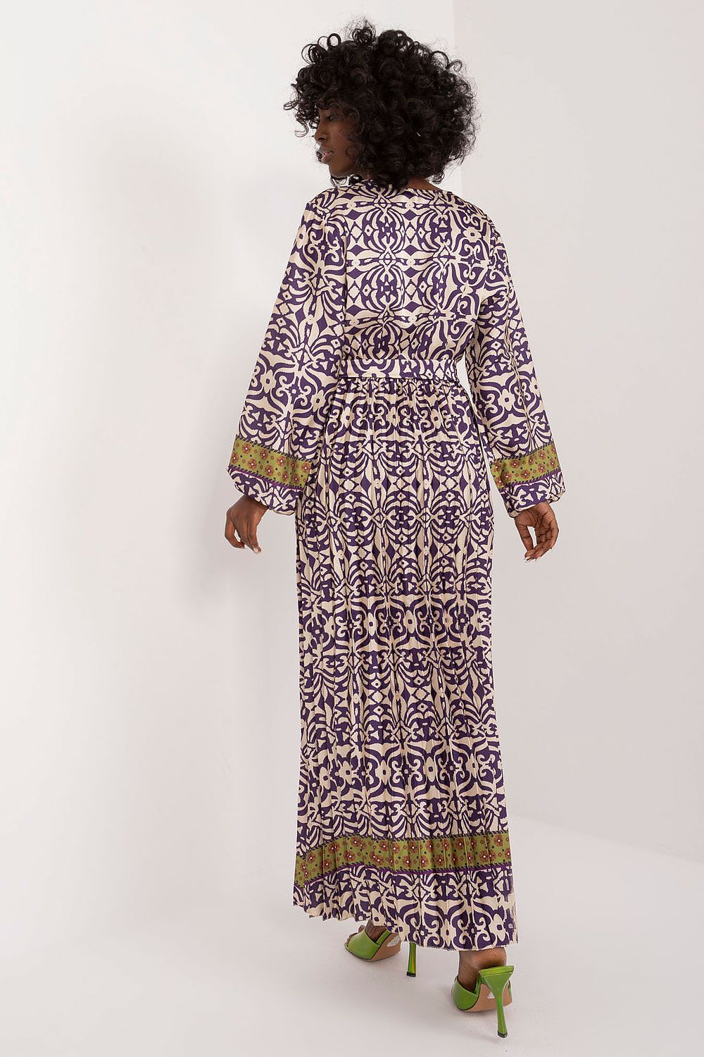Sleek long sleeve maxi dress from Italy Moda, designed with a vibrant print and accentuating tie belt for a stunning silhouette.
