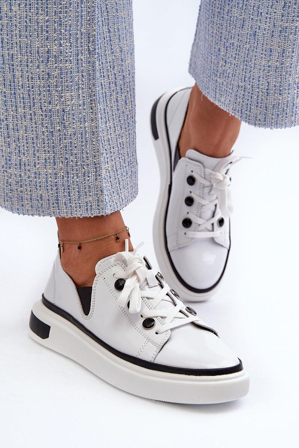 Stylish patent leather platform sneakers for women from Step in Style, showcasing a modern aesthetic with a comfortable fit and superior quality.