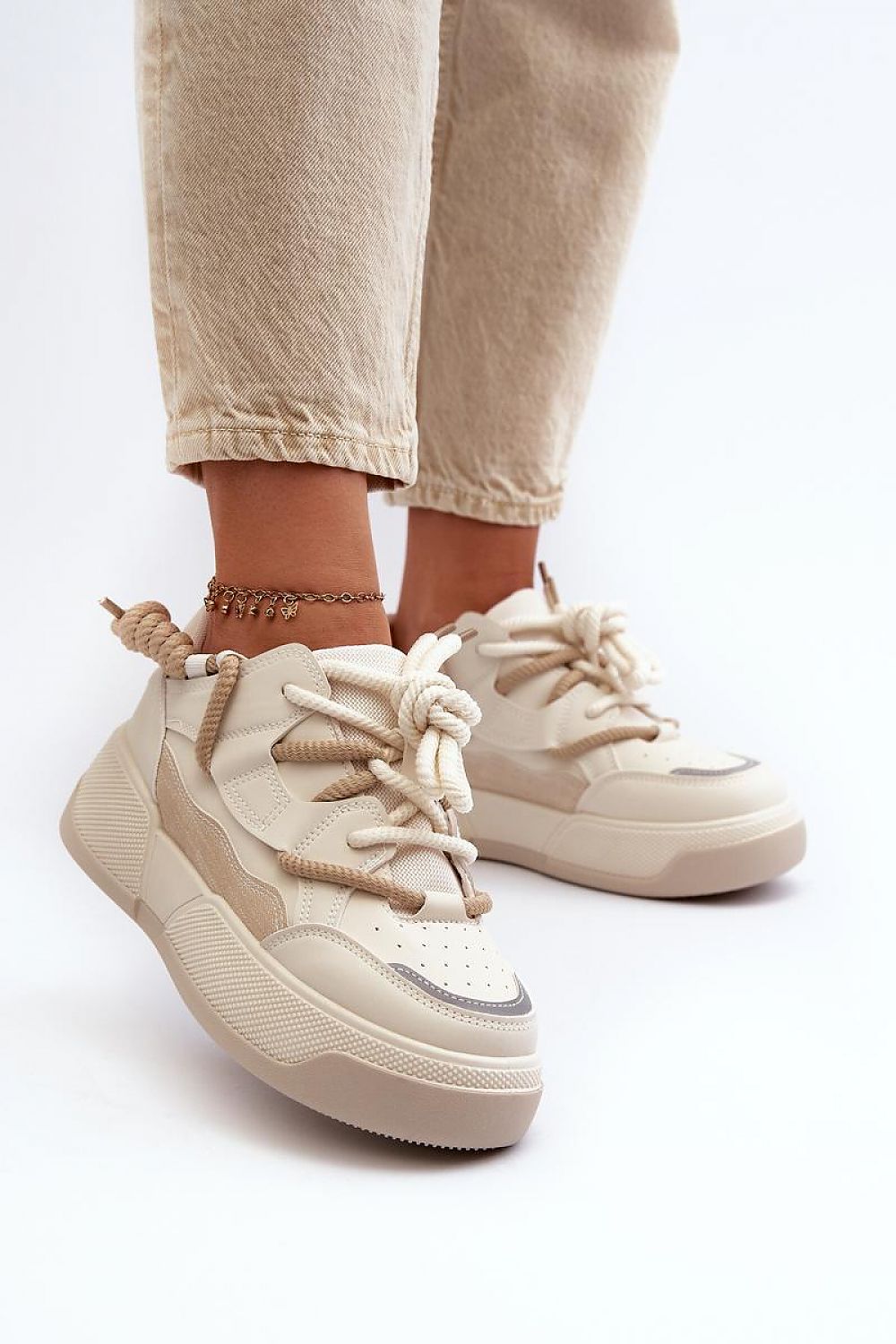 Close-up view of Step in Style women's platform sneakers, showcasing luxurious artificial leather upper and fashion-forward design for a sophisticated look.
