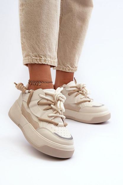 Close-up view of Step in Style women's platform sneakers, showcasing luxurious artificial leather upper and fashion-forward design for a sophisticated look.