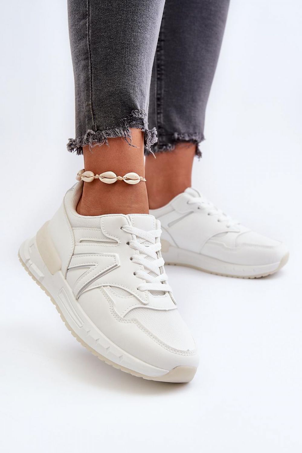 Luxurious pair of women's sneakers by Step in Style, showcasing a chic design with an artificial leather upper and a fashionable 2.5cm platform.