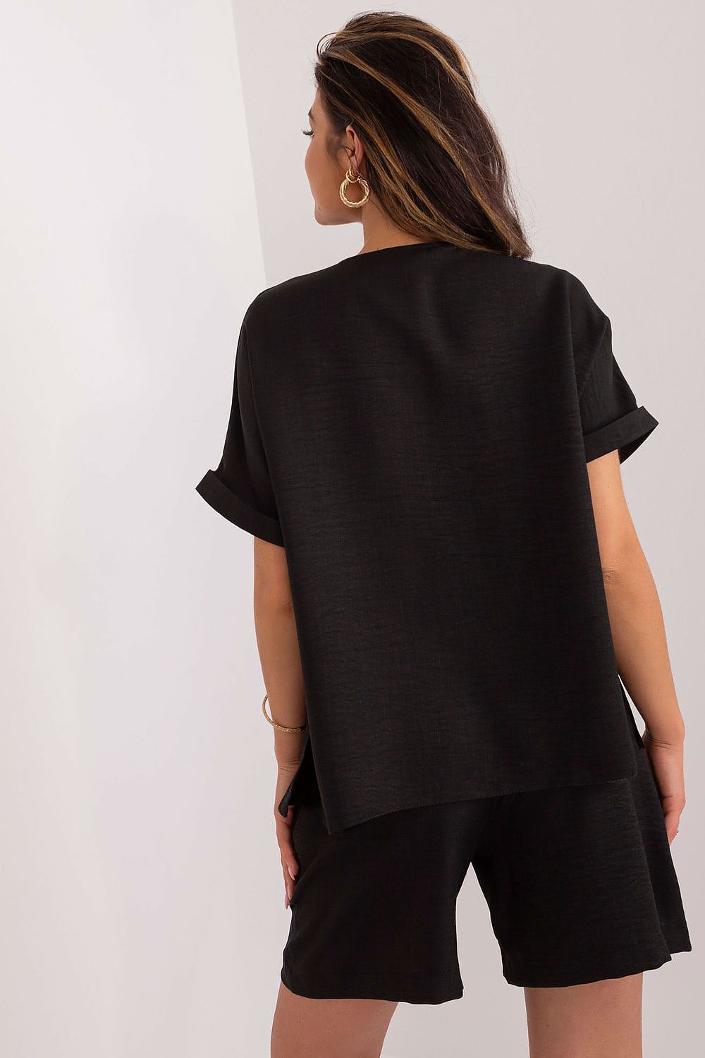 Model showcasing Lakerta's Women's Cotton-Polyester Casual Set in a fashionable summer look with a focus on the V-Neck and side pockets.