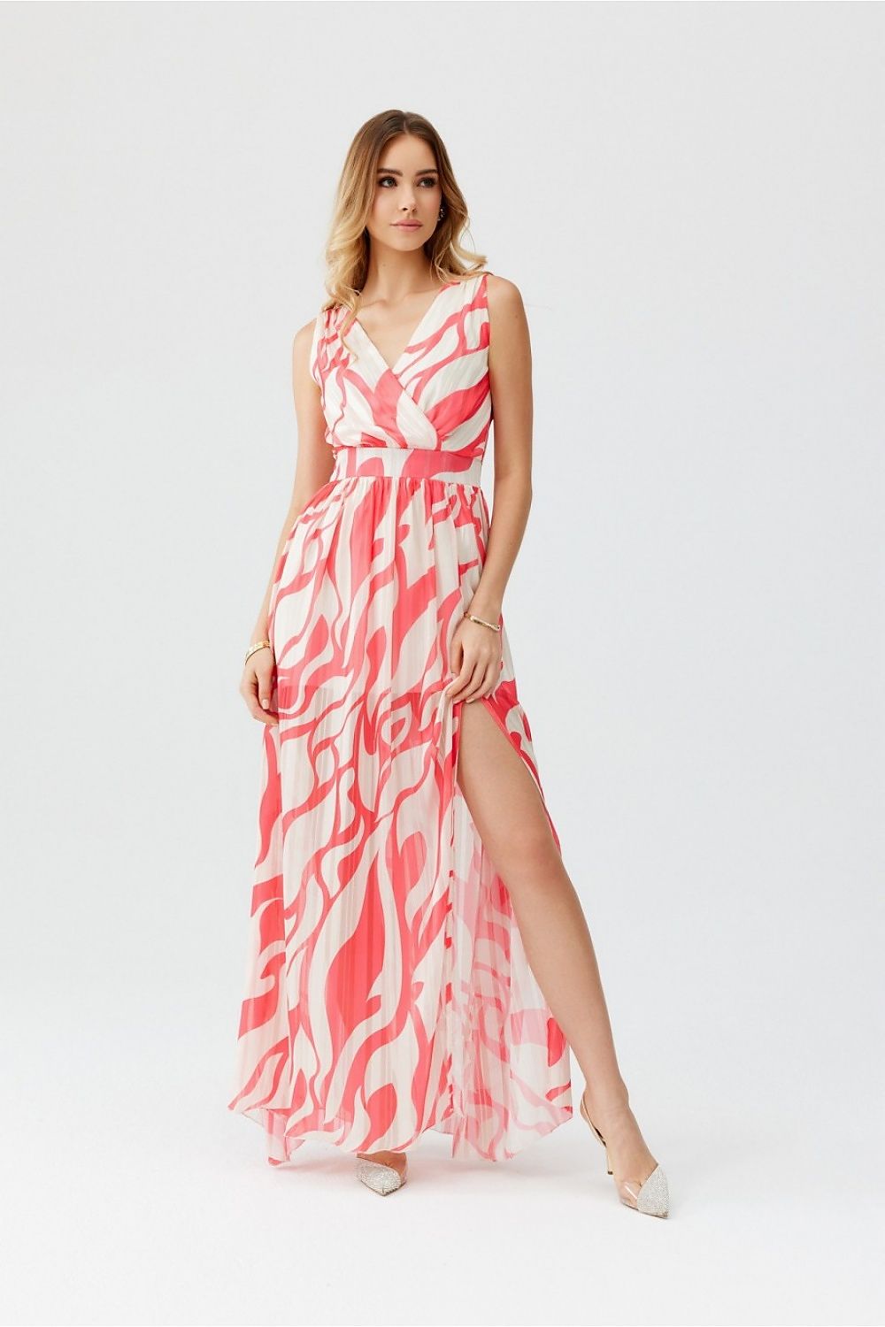 Elegant Roco Fashion maxi chiffon dress with a stylish cutout back, perfect for weddings and summer celebrations.