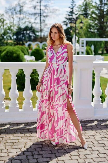 Elegant maxi chiffon dress by Roco Fashion featuring a stunning cutout back design and leg slit for a glamorous and sophisticated look.