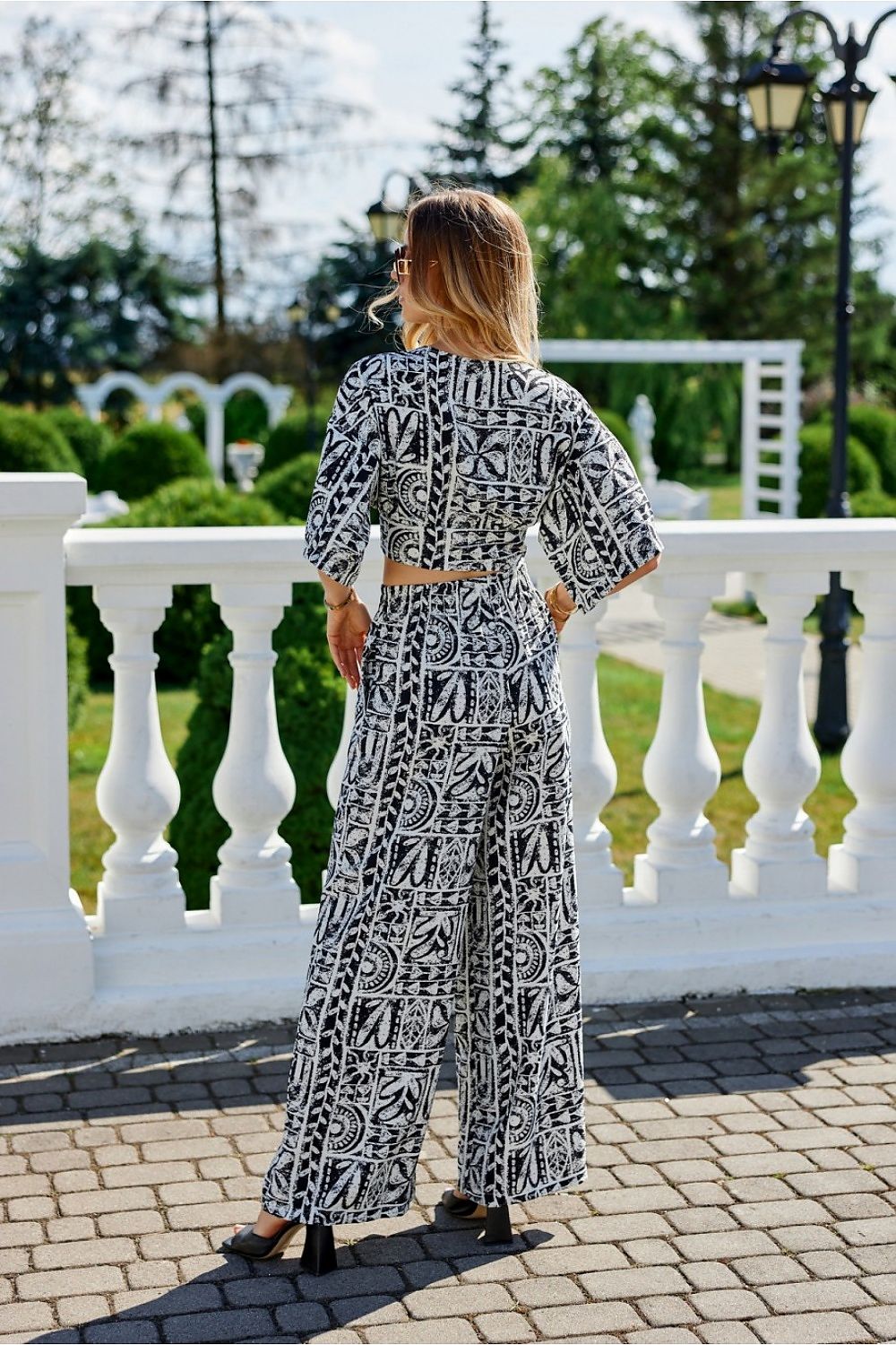 Close-up of Roco Fashion Amber tiered blouse showcasing its refined fabric and trendy front binding detail.