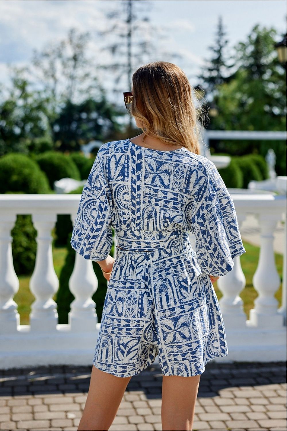 Roco Fashion Amber Tiered Blouse in a luxurious summer design, showcasing a comfortable fit and elegant short sleeves, perfect for versatile summer outfits.