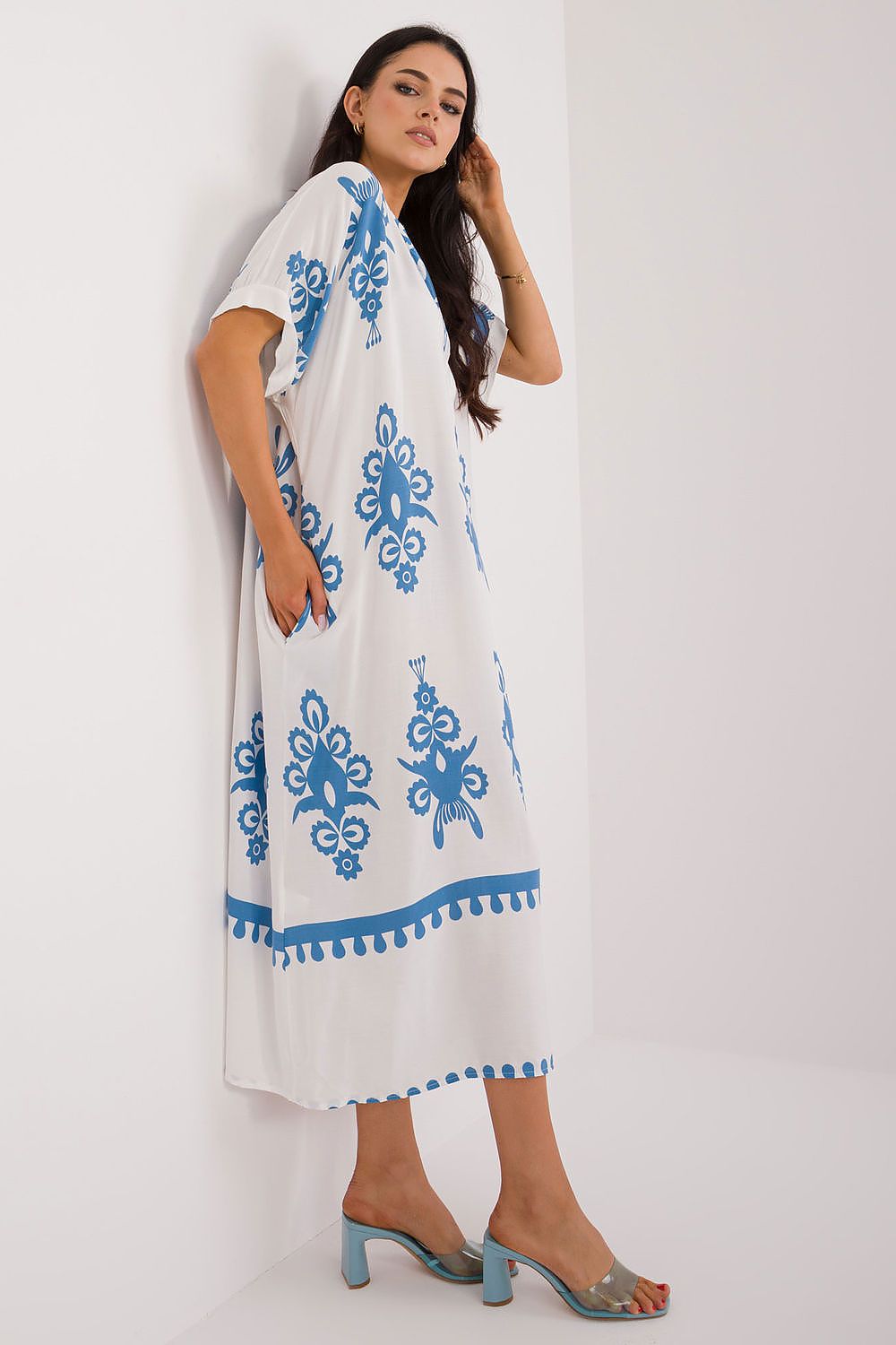 Chic summer dress by Italy Moda showcased in vibrant prints, ideal for casual and work occasions.