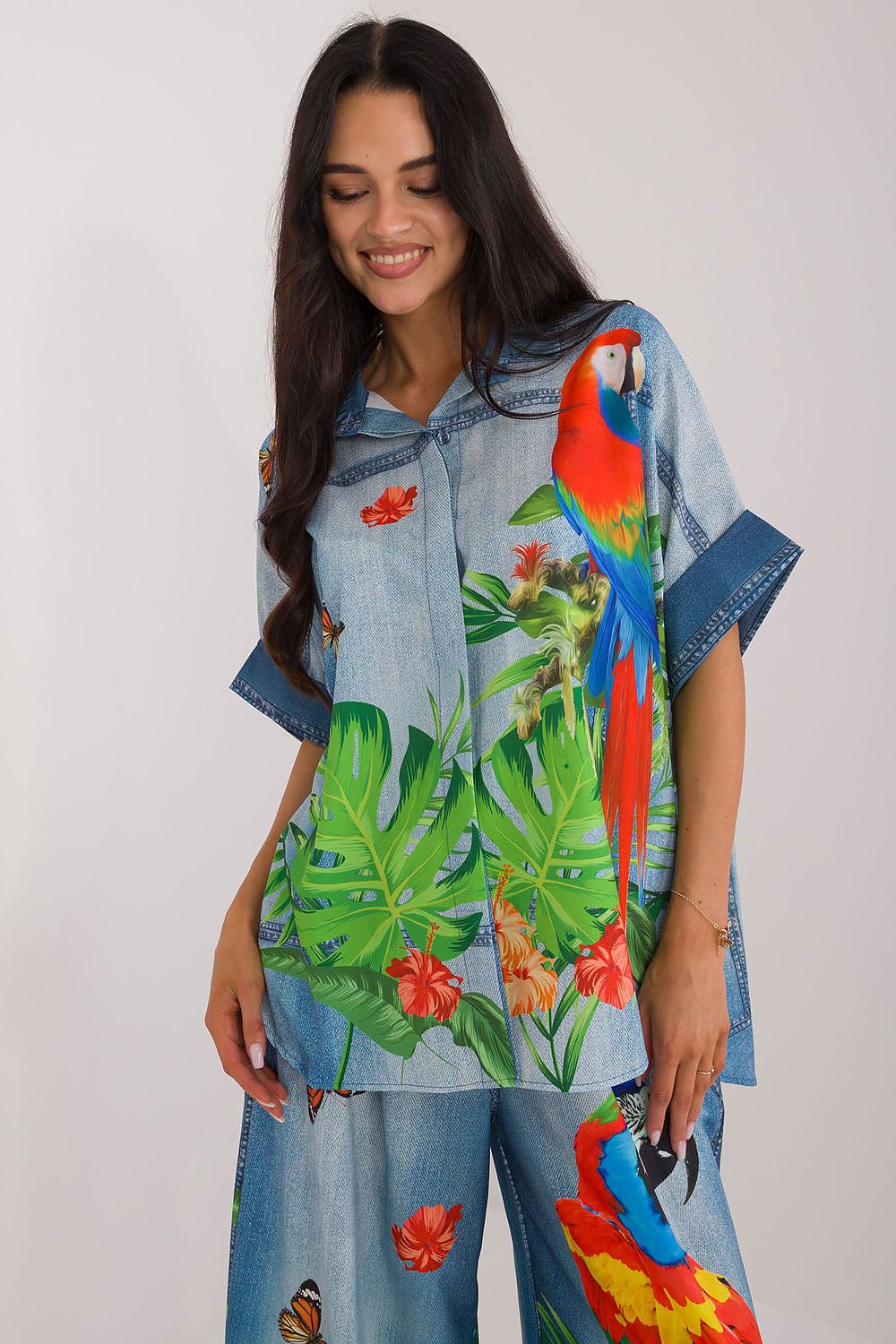 Elegant short sleeve women's blouse by Italy Moda featuring a vibrant floral print for stylish casual wear.