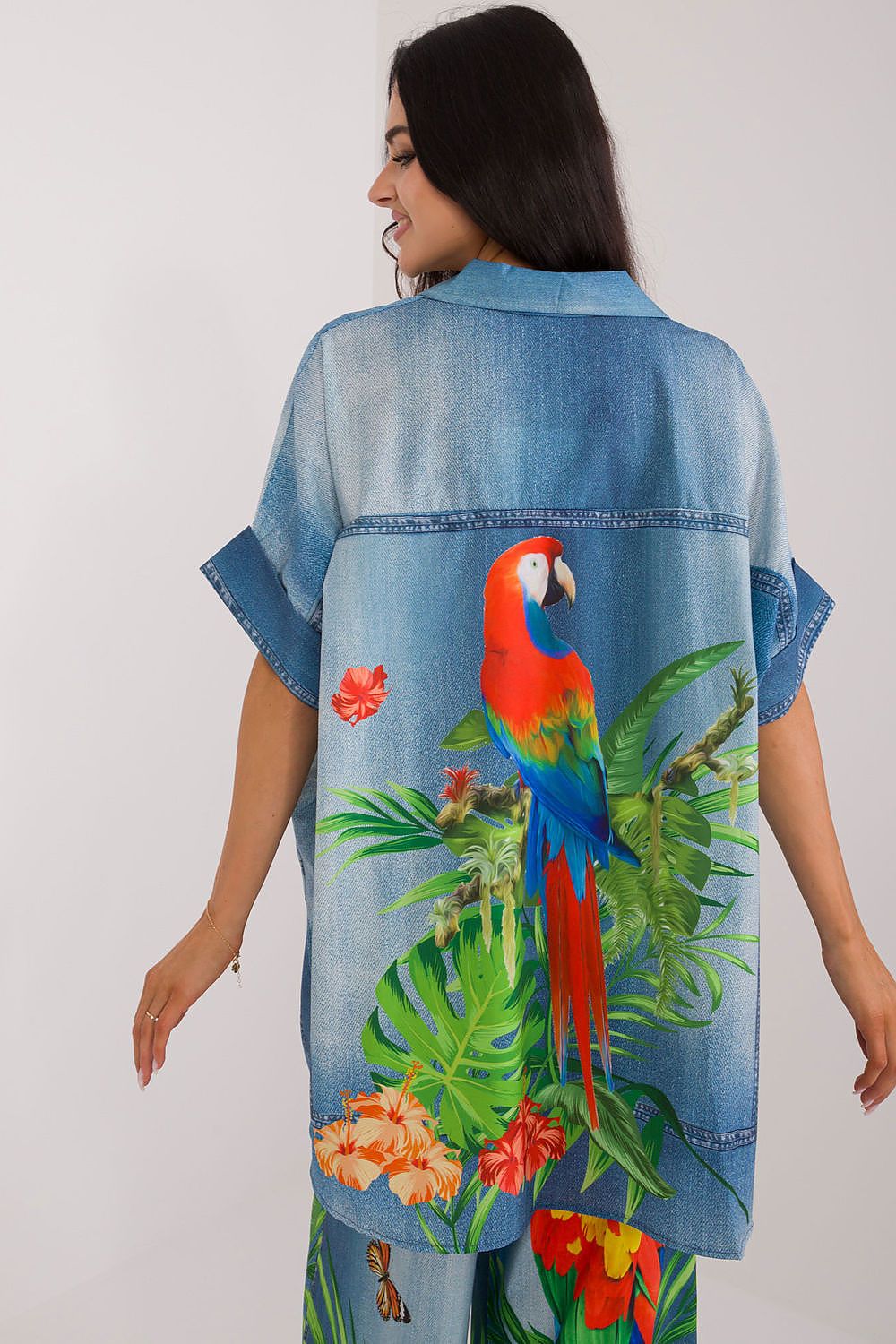 Model wearing Italy Moda's colourful printed viscose blouse, perfect for warm day casual elegance.